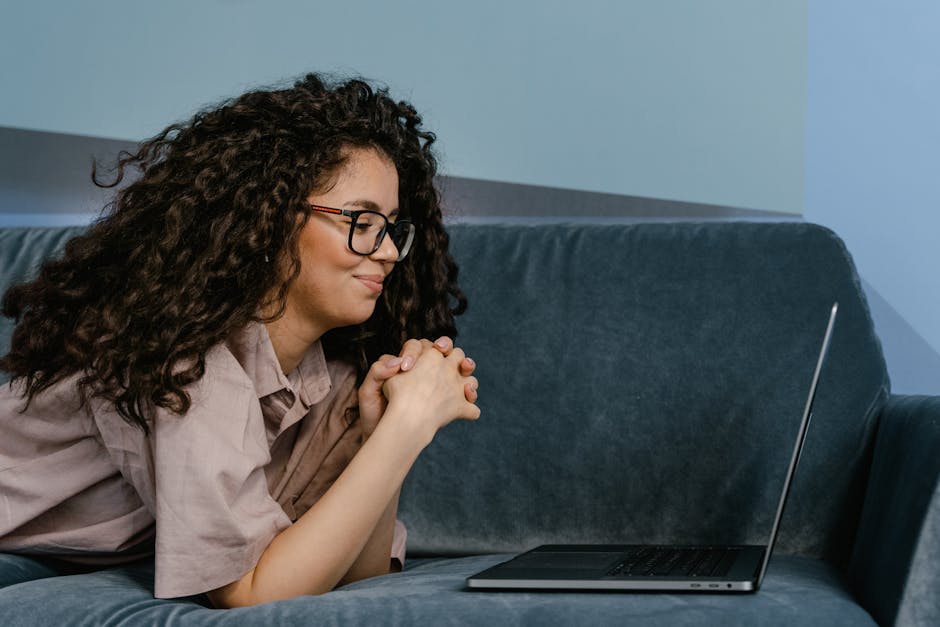 Person watching content on a laptop at home