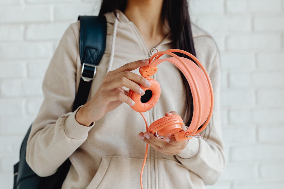 Student looking frustrated while listening with headphones