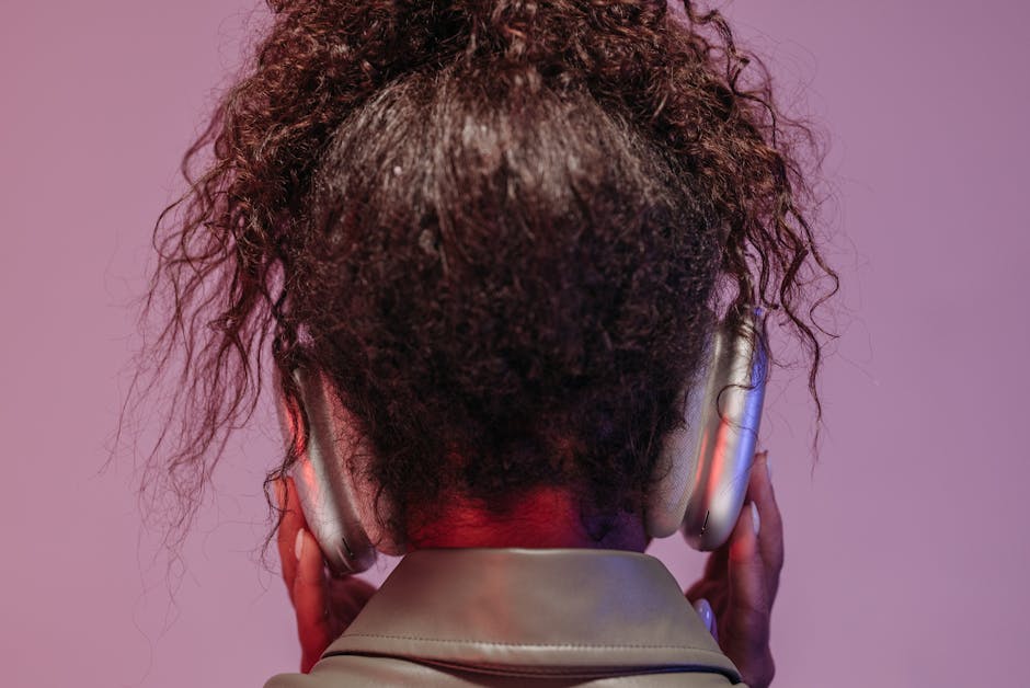 Learner with headphones looking thoughtful while listening