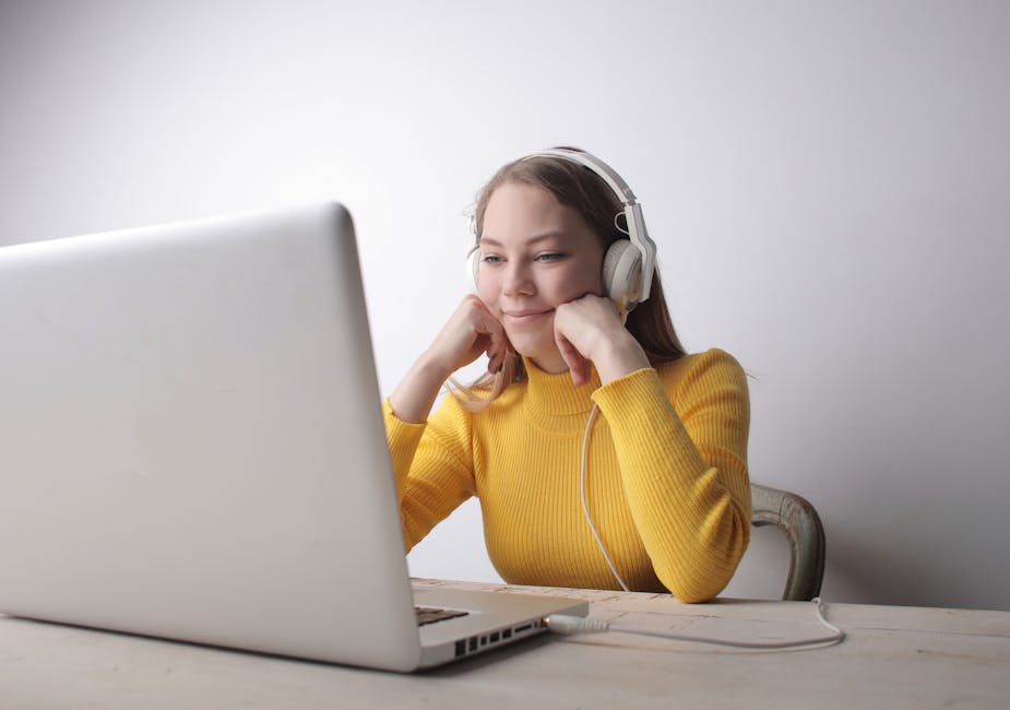 Student using headphones to improve listening comprehension