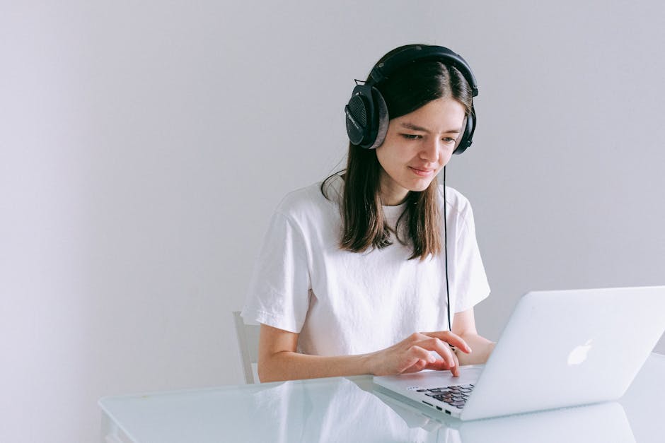 Online English lesson on a laptop with headphones