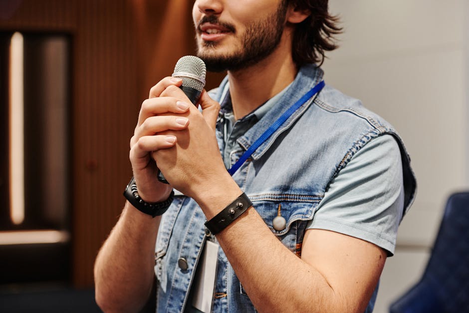 Person speaking naturally into a microphone