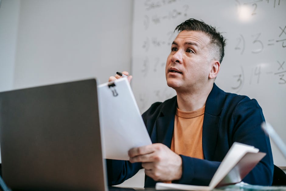Adult learner following an online course on a laptop